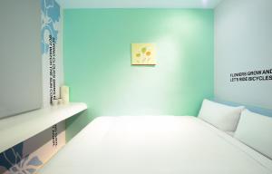 Postel nebo postele na pokoji v ubytování NL Concept Hotel