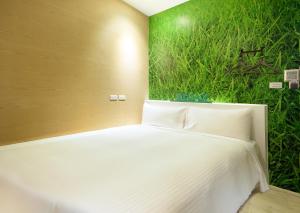 Postel nebo postele na pokoji v ubytování NL Concept Hotel