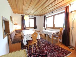 a living room with a table and a dining room at Chalet in St Johann near Ski Slopes in Alpendorf