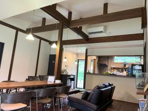 a dining room with a table and chairs at ホシヤドリ hoshiyadori in Setouchi