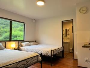 Postel nebo postele na pokoji v ubytování ホシヤドリ hoshiyadori