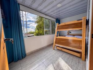 Ένα ή περισσότερα κρεβάτια σε δωμάτιο στο Casa hotel la Pavona Armenia