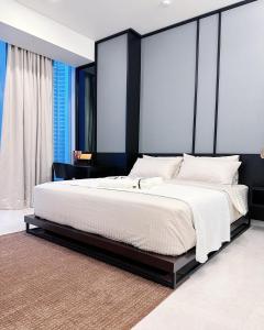 Ένα ή περισσότερα κρεβάτια σε δωμάτιο στο Luxury Suites at Tropicana Residences KLCC by VV +22 φωτογραφίες