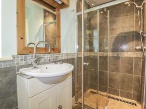 a bathroom with a sink and a shower at Foxes Den in Saint Goran +12 photos