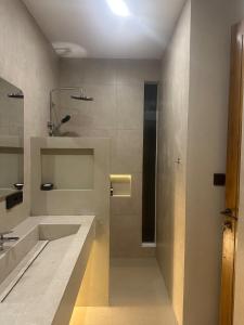 a bathroom with a sink and a shower at Summa Villa - Tropical 2BR Villa w Big Pool in Selong Belanak