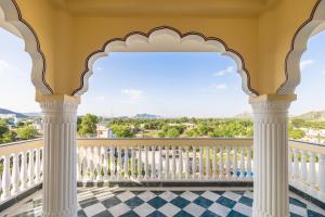 a balcony with a view of the mountains at Umrao Mahal Jaipur in Jaipur +112 photos