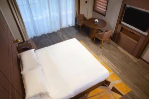 Ένα ή περισσότερα κρεβάτια σε δωμάτιο στο Floral Shefu Inn Rizhao Wanpingkou Dongyi Town Branch +48 φωτογραφίες