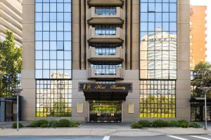 a building with a sign on the front of it at Wyndham Garden Santiago Kennedy in Santiago