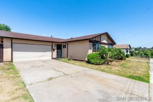 a house with a driveway and a garage at Xlnc Exotic home Rexview Dr in San Diego