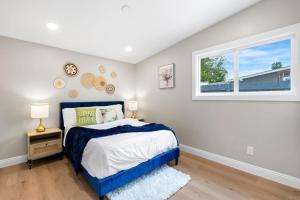 a bedroom with a bed and a window at Xlnc Exotic home Rexview Dr in San Diego