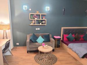 a living room with a couch and a table at Dristy homez in Noida