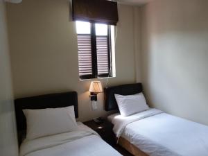 Postel nebo postele na pokoji v ubytování Hotel Hong