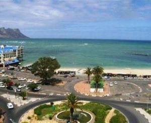 an aerial view of a parking lot next to the ocean at Strand Beach Apart in Strand