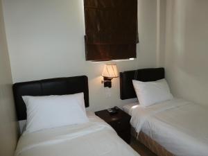 Postel nebo postele na pokoji v ubytování Hotel Hong