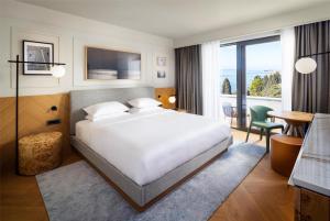 a hotel room with a bed and a balcony at Hyatt Regency Zadar in Zadar