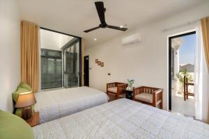 Ένα ή περισσότερα κρεβάτια σε δωμάτιο στο Sanh Homestay +41 φωτογραφίες
