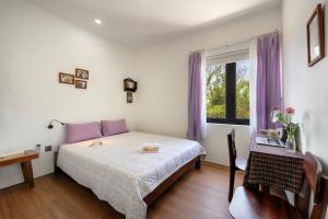 Ένα ή περισσότερα κρεβάτια σε δωμάτιο στο Sanh Homestay