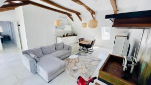 a living room with a couch and a table at Ewelinas Loft in Sundern