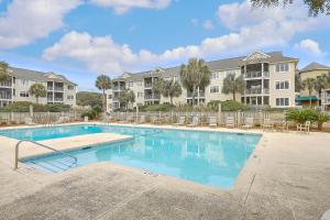 a swimming pool at a apartment complex with condos at Port O' Call E303 - Sensational Oceanview! Top Floor! in Isle of Palms +15 photos