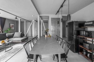 a kitchen and dining room with a table and chairs at SnowGarden YIG STAY in Furano +144 photos
