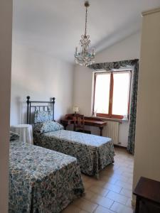 Ένα ή περισσότερα κρεβάτια σε δωμάτιο στο I Gelsi di Colombata Locazione turistica breve in campagna +83 φωτογραφίες