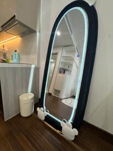 a mirror with stuffed animals sitting on a floor at Mas D3208 in Phú Thú