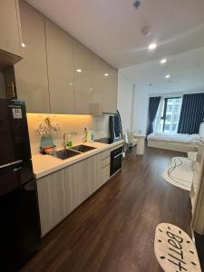 a kitchen with a sink and a counter top at Mas D3208 in Phú Thú