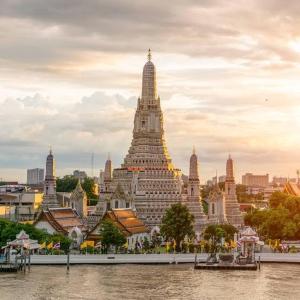 a large building next to a body of water at 3BD3BA Condo|City View|Hot Tub|7-11, PoolGym, Mall in Makkasan +29 photos