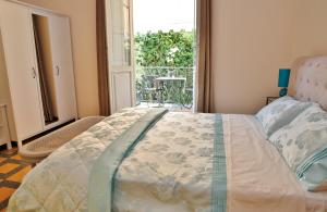 Postel nebo postele na pokoji v ubytování Lucca Relais