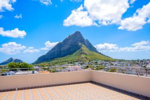 a balcony with a view of a mountain at U & S Luxury Apartments Ltd in Quatre Bornes