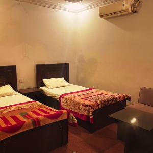 Postel nebo postele na pokoji v ubytování Moon Hotel