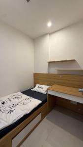 Postel nebo postele na pokoji v ubytování Moon Homestay 0308