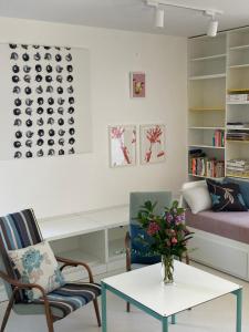 a living room with a couch and a table at Baťovský domek in Zlín
