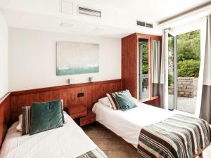 Postel nebo postele na pokoji v ubytování Zaton Holiday Resort + 82 fotografií