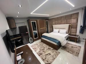 a bedroom with a bed and a television in it at Happy apartment 3 in Cairo
