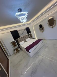 a bedroom with a large bed in a room at Happy apartment 3 in Cairo