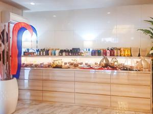 a kitchen with wooden cabinets and an arch in it at Hotel BaliBali 岩槻 in Saitama