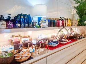 a shelf with baskets of food and drinks on it at Hotel BaliBali 岩槻 in Saitama +29 photos