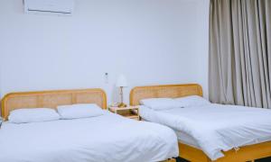 two beds sitting next to each other in a room at Chuncheon bali 376  +28 photos