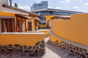 a row of houses with yellow walls at Il Piccolo Borghetto in Rome +21 photos