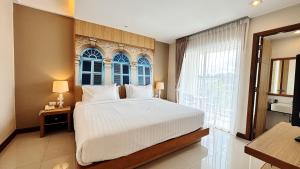 Postel nebo postele na pokoji v ubytování Ratana Hotel Rassada, PHUKET TOWN- SHA Extra Plus