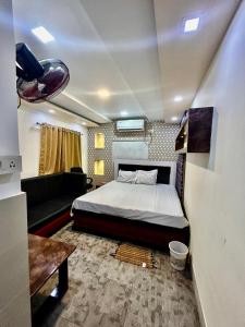 Ένα ή περισσότερα κρεβάτια σε δωμάτιο στο Hotel Royal Stay