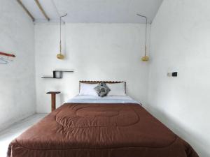 Кровать или кровати в номере Gangga Villa Bromo