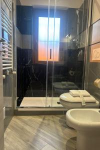 a bathroom with two toilets and a shower at Il Piccolo Borghetto in Rome