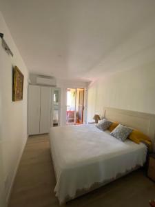 Ένα ή περισσότερα κρεβάτια σε δωμάτιο στο Cosy Casa - Vista unica