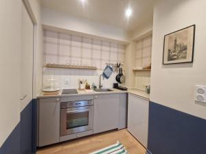 Kuchyň nebo kuchyňský kout v ubytování Puy-de-Dôme #Hypercentre