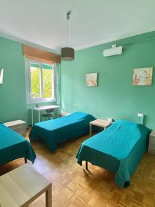 Ένα ή περισσότερα κρεβάτια σε δωμάτιο στο Green House - Manerbio