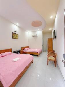 Postel nebo postele na pokoji v ubytování Cali Hotel Tây Ninh