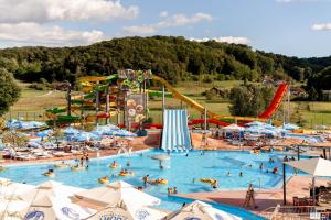 a large water park with people in a pool at Apartmani Ivica i Mirica in Tuheljske Toplice
