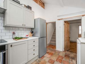Kuchyň nebo kuchyňský kout v ubytování Cosy Cottage